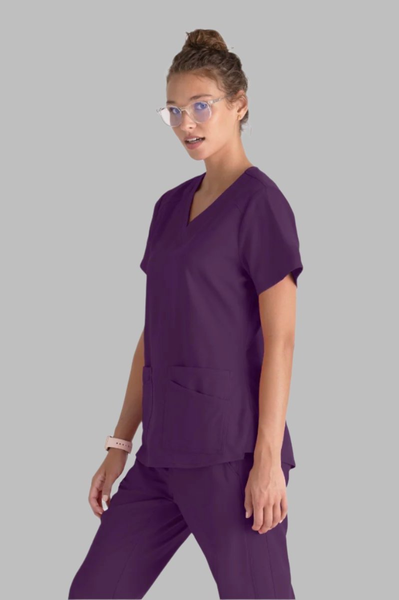 Greys Anatomy Emma 4 pocket, V-neck scrub top with angled seams | Eggplant