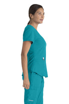 SKECHERS BREEZE 3-POCKET SHAPED HEM TOP | Teal