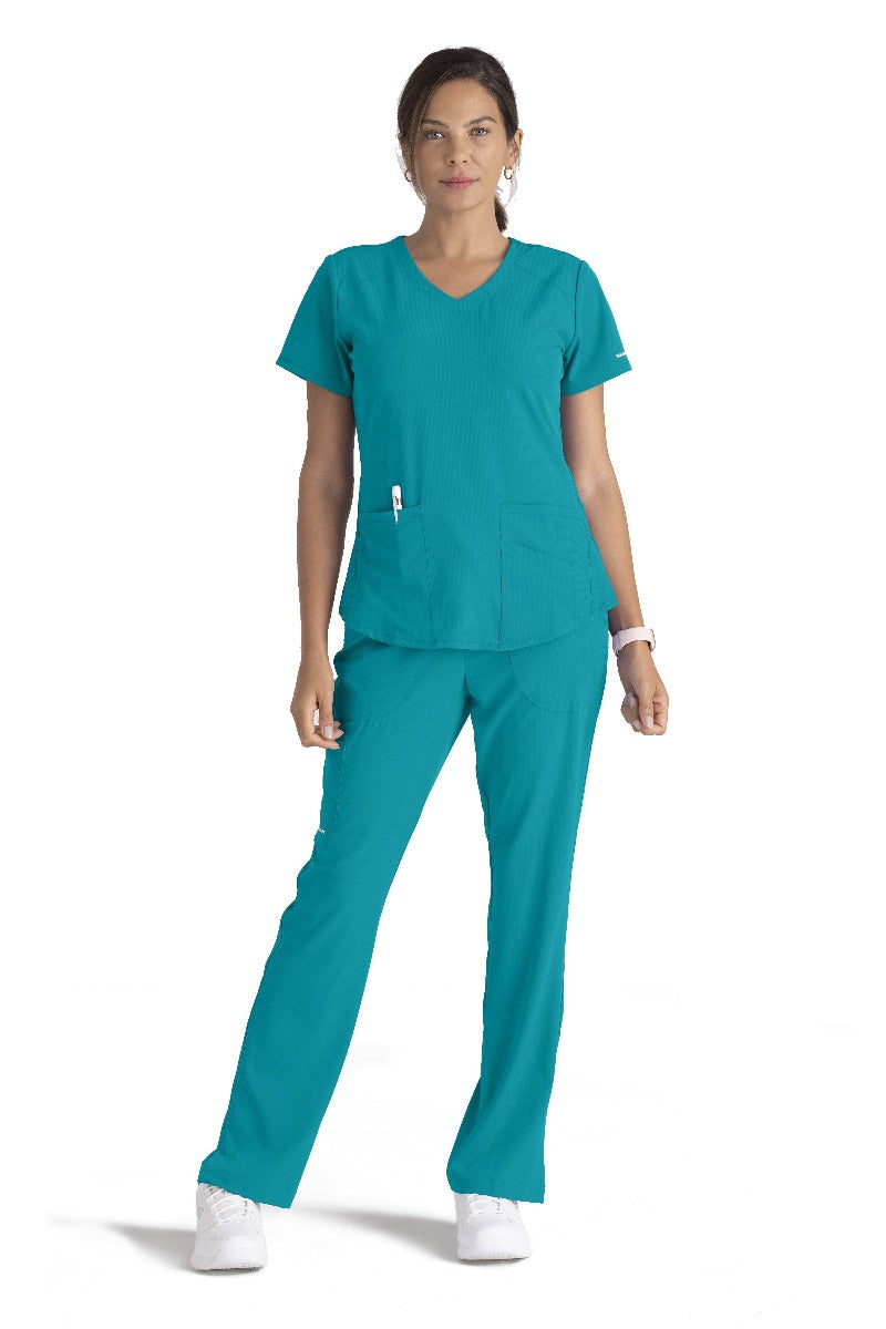 SKECHERS BREEZE 3-POCKET SHAPED HEM TOP | Teal