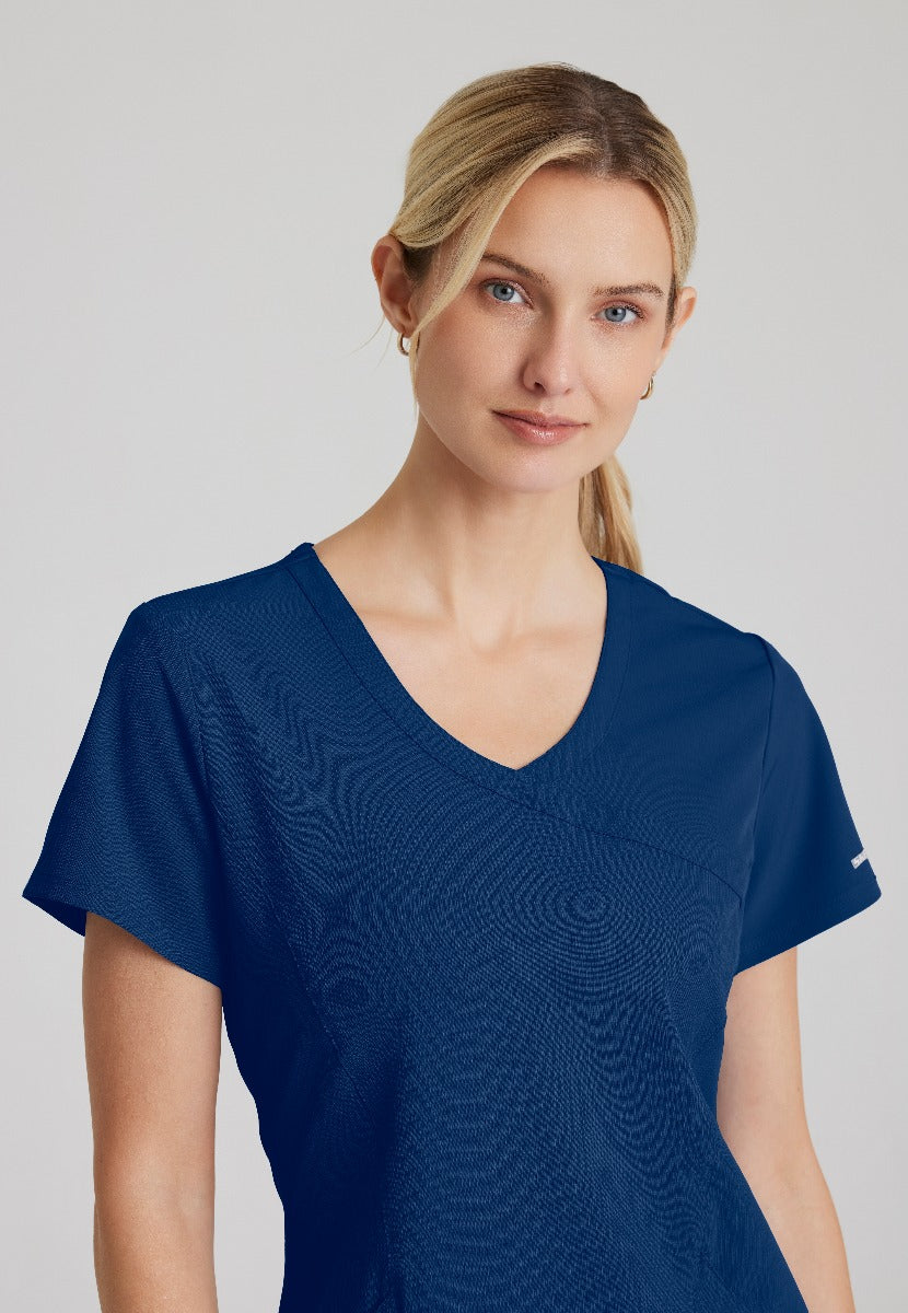 SKECHERS FEMALE RELIANCE 3-POCKET WRAP EFFECT TOP | NAVY